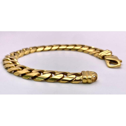 72 - A Chunky 9K Yellow Gold Flat Curb Link Bracelet. 19cm. 37.2g weight