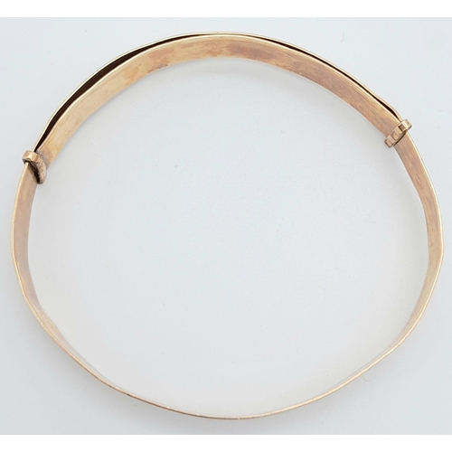 63 - An Albion 9K gold with metal core adjustable bangle. Total weight 10.8G. Please see photos for detai... 