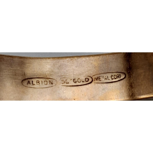 63 - An Albion 9K gold with metal core adjustable bangle. Total weight 10.8G. Please see photos for detai... 