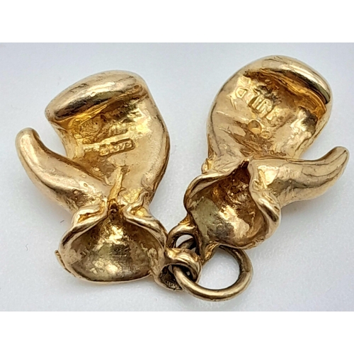 24 - A 9K YELLOW GOLD SOLID BOXING GLOVE CHARMS. TOTAL WEIGHT 4.3G