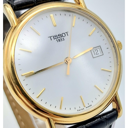 43 - An 18K Gold Cased Tissot Carson Quartz Gents Watch. Original black leather strap. 18K gold case - 34... 