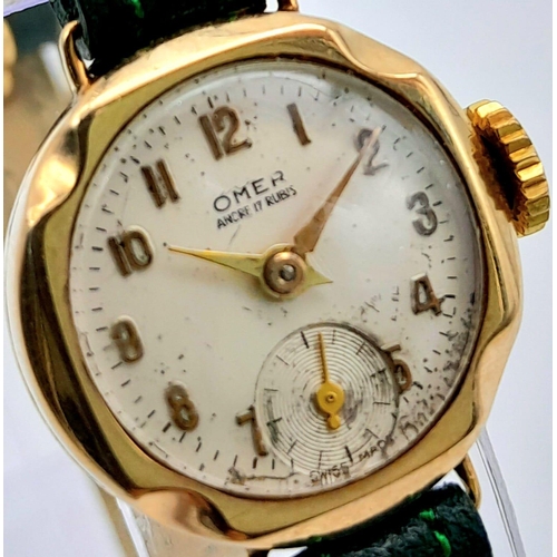 685B - A Vintage Omer 9K Gold Cased Ladies Watch. New green leather strap. 9K gold case - 21mm. White dial ... 