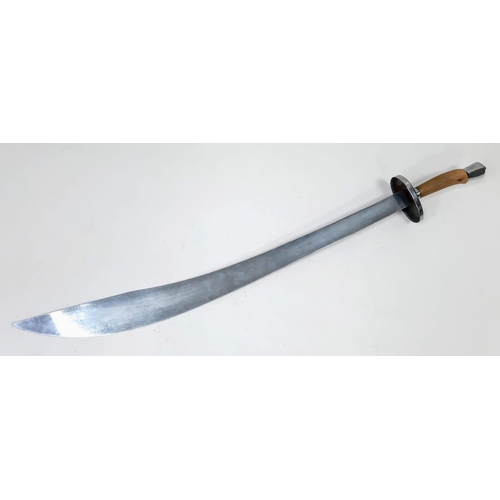 515 - A Stainless Steel Chinese Broad Sword.
Measures 93cm in length. See photo for condition.