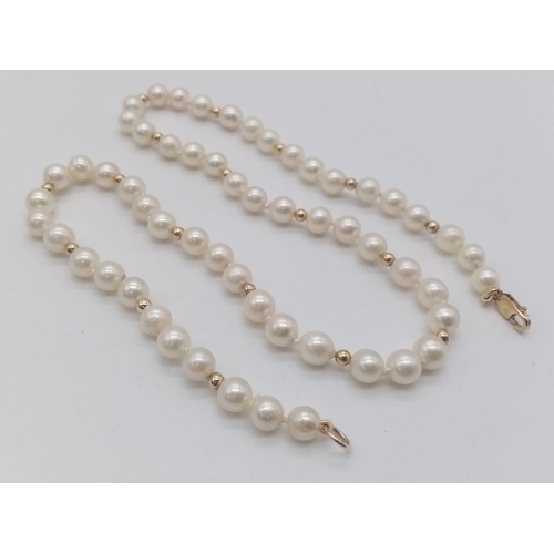 836B - A Cultured Pearl Necklace with 9K Gold Spacers and Clasp. 
44cm length. 21.2g weight.