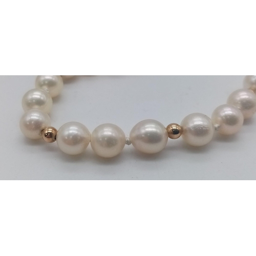 836B - A Cultured Pearl Necklace with 9K Gold Spacers and Clasp. 
44cm length. 21.2g weight.