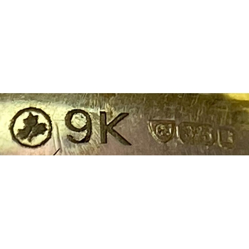 1704 - A 9K Yellow and White Gold Ring - Diagonally channel set with three round brilliant cut diamonds. Bo... 