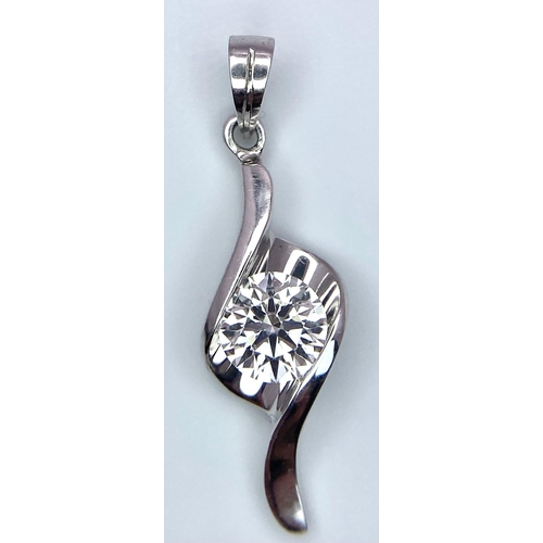 104 - An 18 K white gold drop pendant with a single brilliant round cut diamond (0.52 carats), total weigh... 