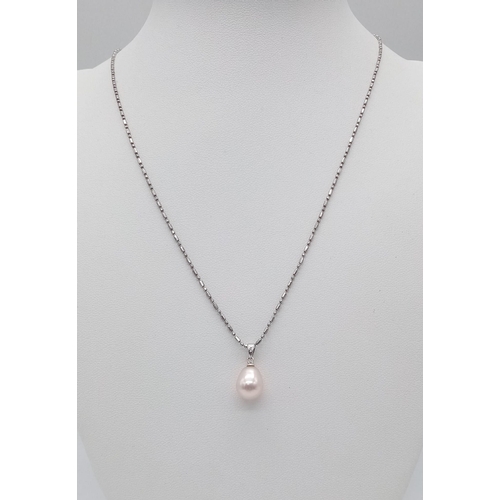 1078 - A sterling silver chain necklace with a tear drop shaped natural pearl pendant. Chain length: 44 cm,... 