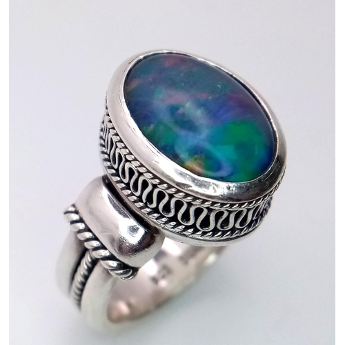 1095 - A Vintage Sterling Silver Suarti Opal Set Ring Size M. Set with a 1.3cm Oval Cut Opal in a Raised Ga... 