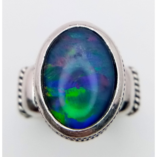 1095 - A Vintage Sterling Silver Suarti Opal Set Ring Size M. Set with a 1.3cm Oval Cut Opal in a Raised Ga... 