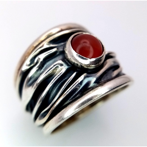 1097 - A Sterling Silver Mexican Ruby Set Bark Pattern Ring Size L. The Ring Measures 1.6cm Wide at the Cro... 