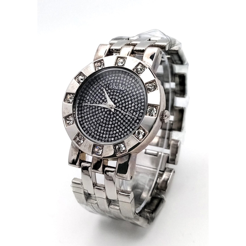 1098 - An Unworn Versedge Stone Set Stainless Steel Quartz Watch. 37mm Including Crown. Still in protective... 