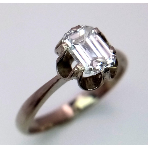 127 - An 18K White Gold (tested) Emerald Cut Diamond Solitaire Ring. Beautiful 1ct central diamond. Size P... 