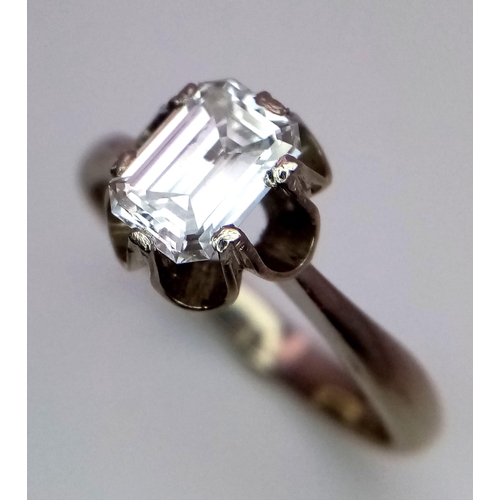 127 - An 18K White Gold (tested) Emerald Cut Diamond Solitaire Ring. Beautiful 1ct central diamond. Size P... 