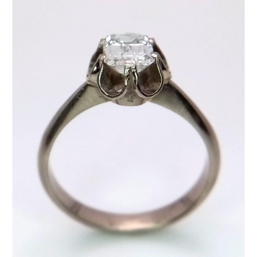 127 - An 18K White Gold (tested) Emerald Cut Diamond Solitaire Ring. Beautiful 1ct central diamond. Size P... 