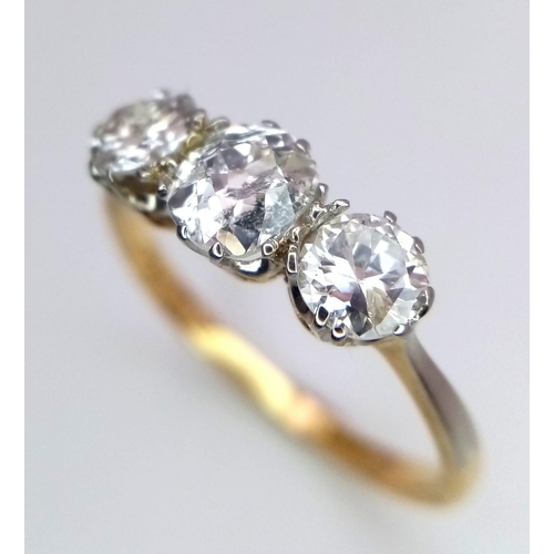 13 - An 18 k yellow gold ring with a trilogy of brilliant round cut diamonds (1 carat min.), ring size: L... 