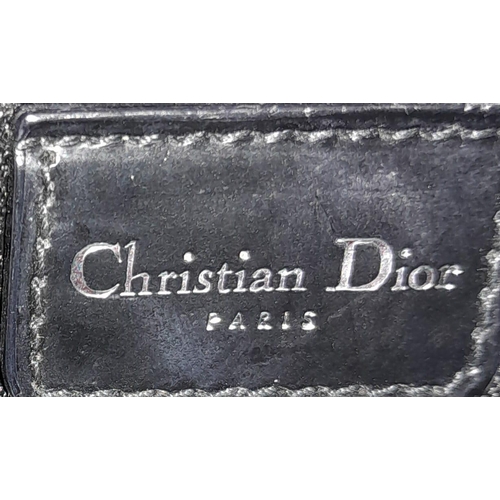 144 - A Christian Dior - Lady Dior Bag. Canvas and black patent leather exterior. Silver tone hardware. Mo... 