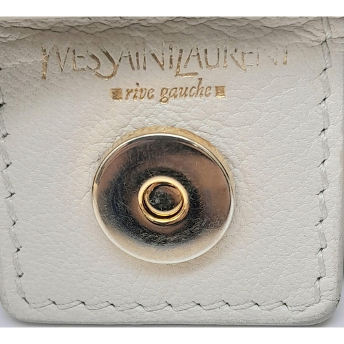 193 - A YSL Saint-Tropez Leather Double Horn Hobo Bag. Ivory leather strip exterior. Horn shaped handles. ... 