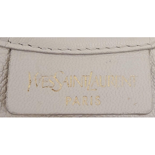 193 - A YSL Saint-Tropez Leather Double Horn Hobo Bag. Ivory leather strip exterior. Horn shaped handles. ... 