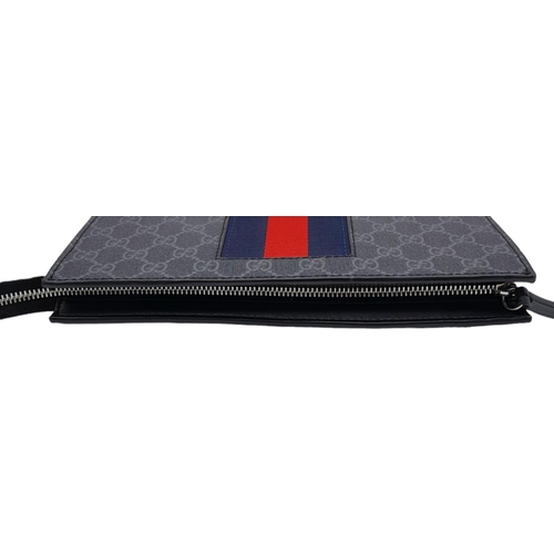 242 - A Gucci GG Supreme Pouch Canvas Bag. Monogram exterior with blue and red stripes. Beige textile inte... 