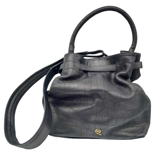 249 - An Alexander Mcqueen Black Leather Hand/Shoulder Bag. Checked black leather exterior. Spacious inter... 