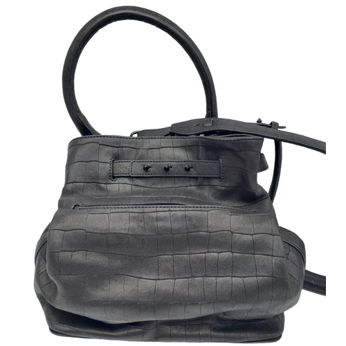 249 - An Alexander Mcqueen Black Leather Hand/Shoulder Bag. Checked black leather exterior. Spacious inter... 