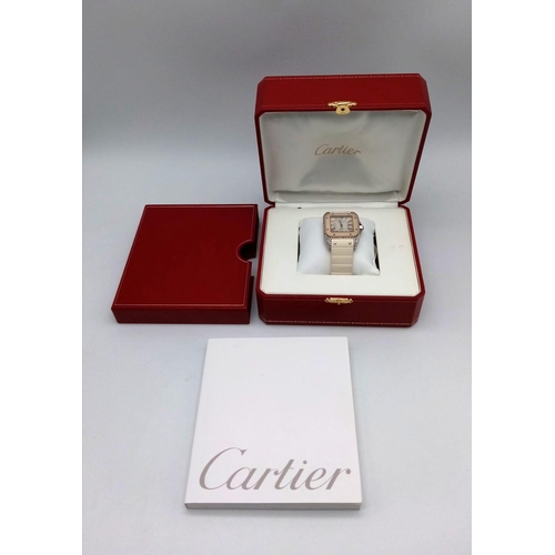 25 - A Cartier Santos 100 Automatic Unisex Diamond Watch. White rubber Cartier strap with diamond buckle.... 