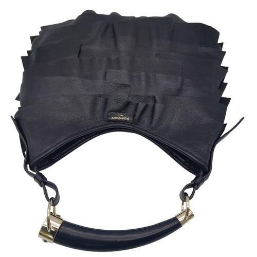 263 - A YSL Saint-Tropez Handbag. Black leather strip exterior. Horn shaped handle. Textile interior with ... 