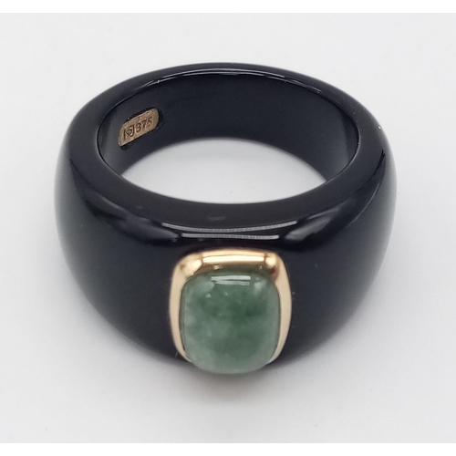 290 - An Unworn Rare Black Resin Encased 9 Carat Yellow Gold Jade Set Ring Size M. The Ring is set with 9m... 