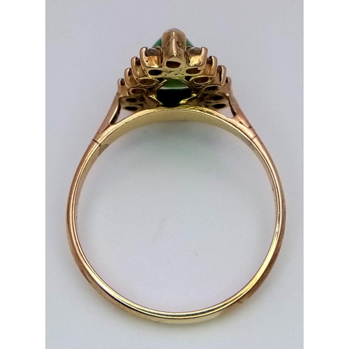 305 - An 18K Gold Jade and Diamond Ring. Central teardrop jade with a diamond surround. Size M. 2.73g tota... 