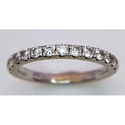 312 - An 18K White Gold and Diamond Half Eternity Ring. Size K/L.
2.85g total weight. Ref: 15620