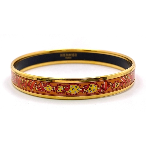 326 - A Hermes Gilded and Enamel Bangle. 6cm inner diameter. Ref: 15686