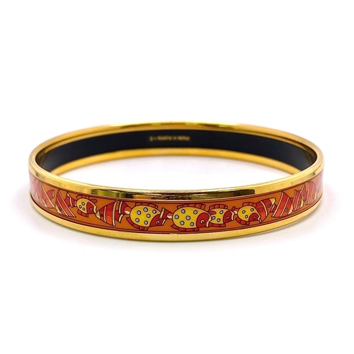 326 - A Hermes Gilded and Enamel Bangle. 6cm inner diameter. Ref: 15686