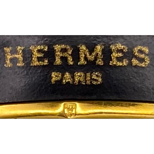 326 - A Hermes Gilded and Enamel Bangle. 6cm inner diameter. Ref: 15686