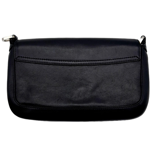 347 - A Gucci Black Leather Flap Hand Bag. Silver-tone hardware. Black textile interior with zipped compar... 