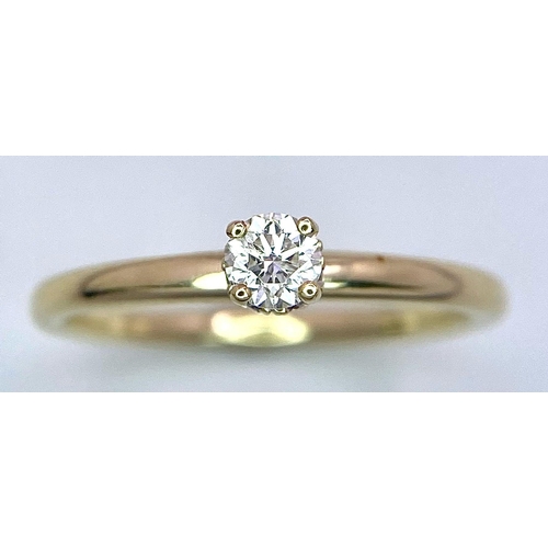 349 - A 9 K yellow gold ring with a brilliant cut diamond (0.25 carats) standing proud and a halo of diamo... 