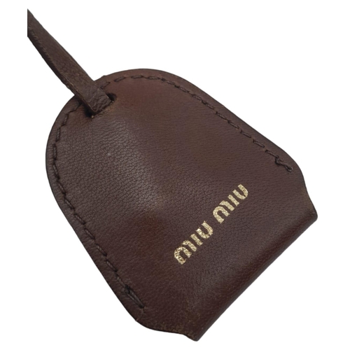 382 - A Miu Miu Brown Leather Handbag. Ruffled leather exterior with two pocketed compartments. Gold tone ... 