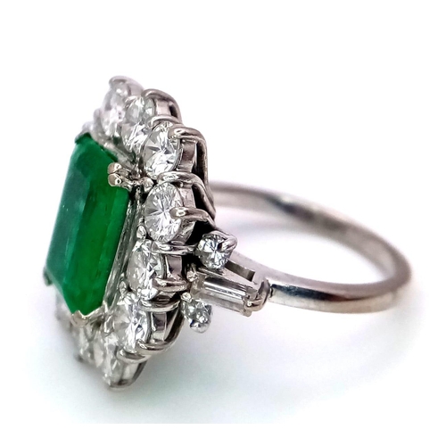 39 - A Head-Turning 18K White Gold, Emerald and Diamond Ladies Dress Ring. Rectangular emerald with a 12 ... 