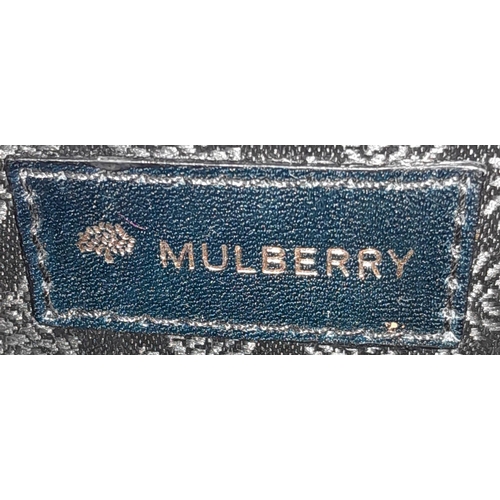 445 - A Black Leather Mulberry Baguette Bag. Textured exterior with Mulberry logo. Decorative textile inte... 