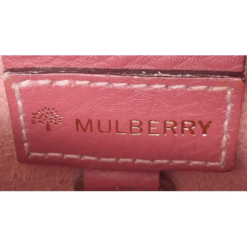 466 - A Mulberry Burgundy Leather Flap Hand/Shoulder bag. Belt buckle fastener. Gold-tone hardware. 26cm l... 