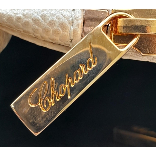 473 - A Chopard Cream Leather Ladies Handbag. Textured exterior with gold tone hardware and Chopard logo. ... 