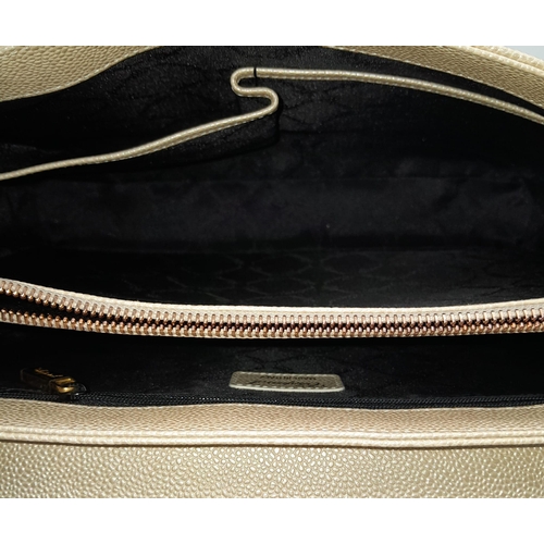 473 - A Chopard Cream Leather Ladies Handbag. Textured exterior with gold tone hardware and Chopard logo. ... 