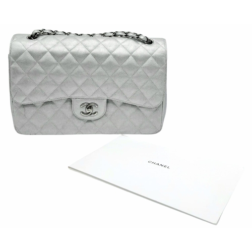 53 - A Chanel Metallic Silver Double Flap Jumbo Bag. Quilted caviar leather. Silver tone hardware. Double... 