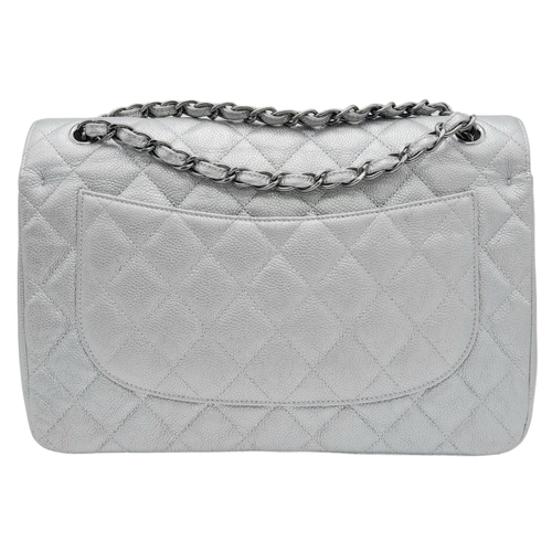 53 - A Chanel Metallic Silver Double Flap Jumbo Bag. Quilted caviar leather. Silver tone hardware. Double... 