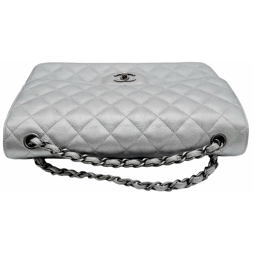 53 - A Chanel Metallic Silver Double Flap Jumbo Bag. Quilted caviar leather. Silver tone hardware. Double... 