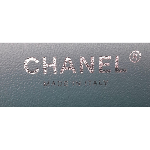 67 - A Chanel Jumbo Double Flap Bag. Beautiful pale blue quilted caviar leather exterior. Double entwined... 