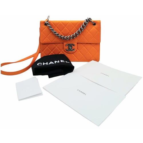 74 - A Chanel Quilted Orange Caviar Leather Shoulder Bag. Quilted pattern exterior with gunmetal hardware... 