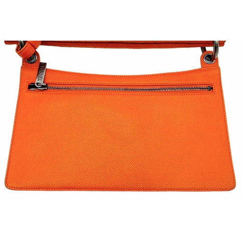 74 - A Chanel Quilted Orange Caviar Leather Shoulder Bag. Quilted pattern exterior with gunmetal hardware... 