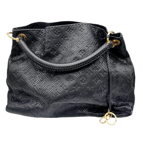 81 - A Louis Vuitton Monogram Black Snakeskin Tote Bag. Gold tone hardware. Spacious black leather interi... 