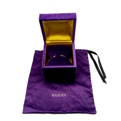 99 - An 18K Yellow Gold Gucci Designer Cuff Bangle. Comes with a variety of plush Gucci packaging items. ... 